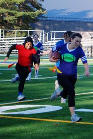 Phi Beta Chi's Julia Weis '12, (blue), gets ready to score with Sigma Lambda Upsilon's Laura Lee Smith '11 (red) in hot pursuit.